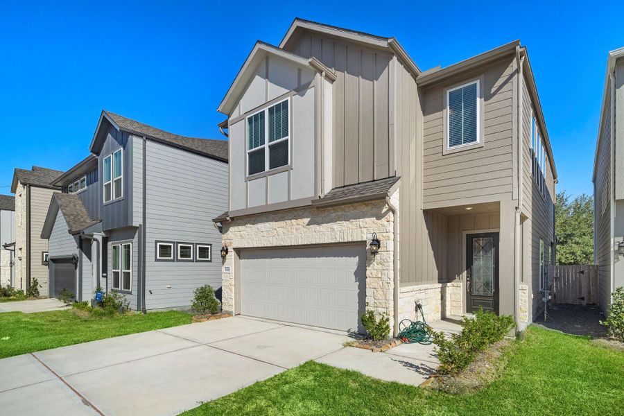 This charming modern patio home greets you with a sleek, low-maintenance exterior that showcases clean lines and a welcoming entrance.