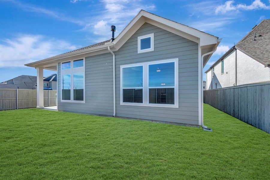 Back of property with a fenced backyard and a patio Back of property with a fenced backyard and a patio