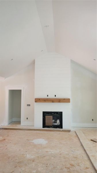 Vaulted ceilings soar above a striking shiplap fir Vaulted ceilings soar above a striking shiplap fir