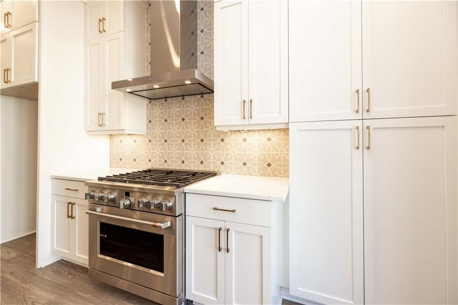 Custom cabinetry provides ample storage, while soft-close drawers and premium hardware add a refined, quiet luxury to every detail.This photo is from another community and not representative of this homesite.