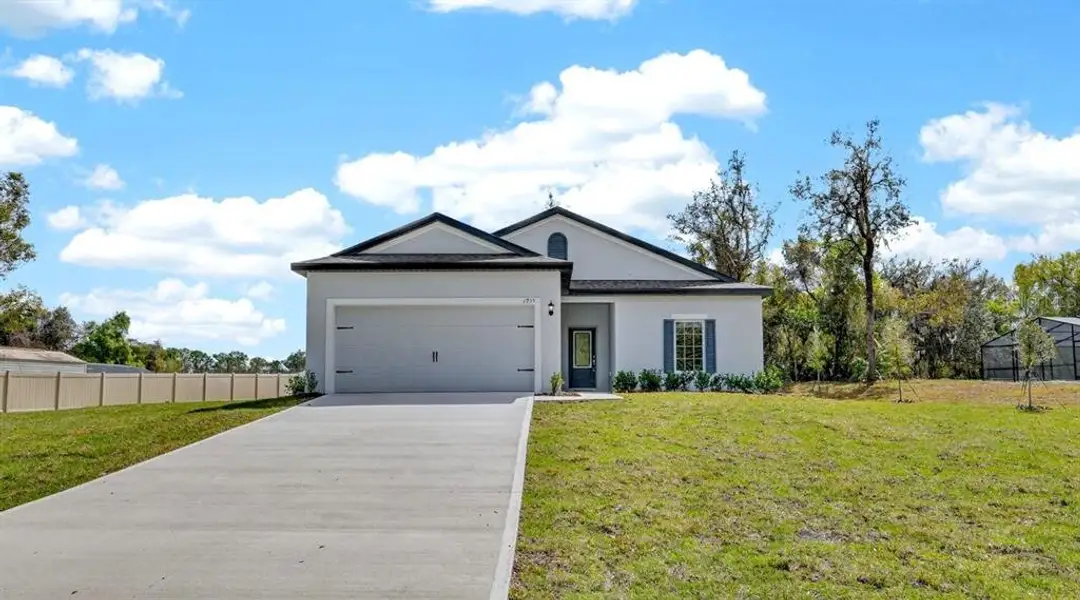 Front exterior of a new home in , Deltona, FL, highlighting curb appeal (Image 21).