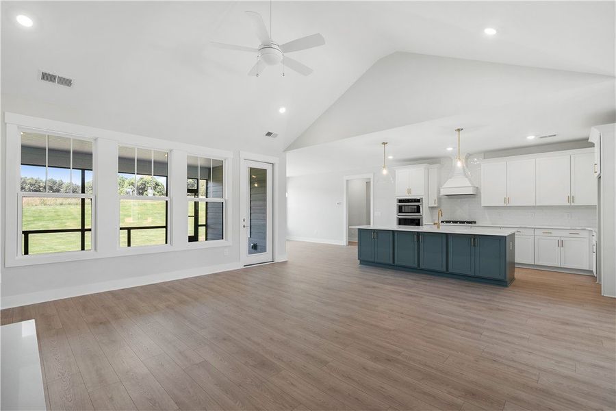 An open floorplan living area features vaulted cei An open floorplan living area features vaulted cei