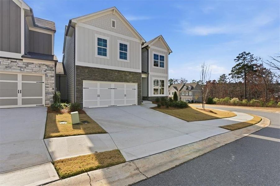 Front exterior of a new home in Lakeside at Great Sky, Canton, GA, highlighting curb appeal (Image 2).