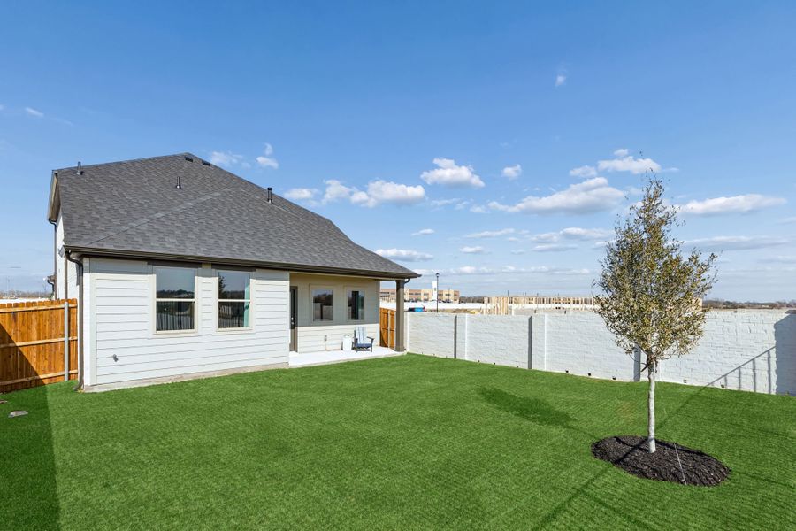 Covered Patio in a Nicholson Ranch Magnolia Model Home in Lavon TX by Trophy Signature Homes