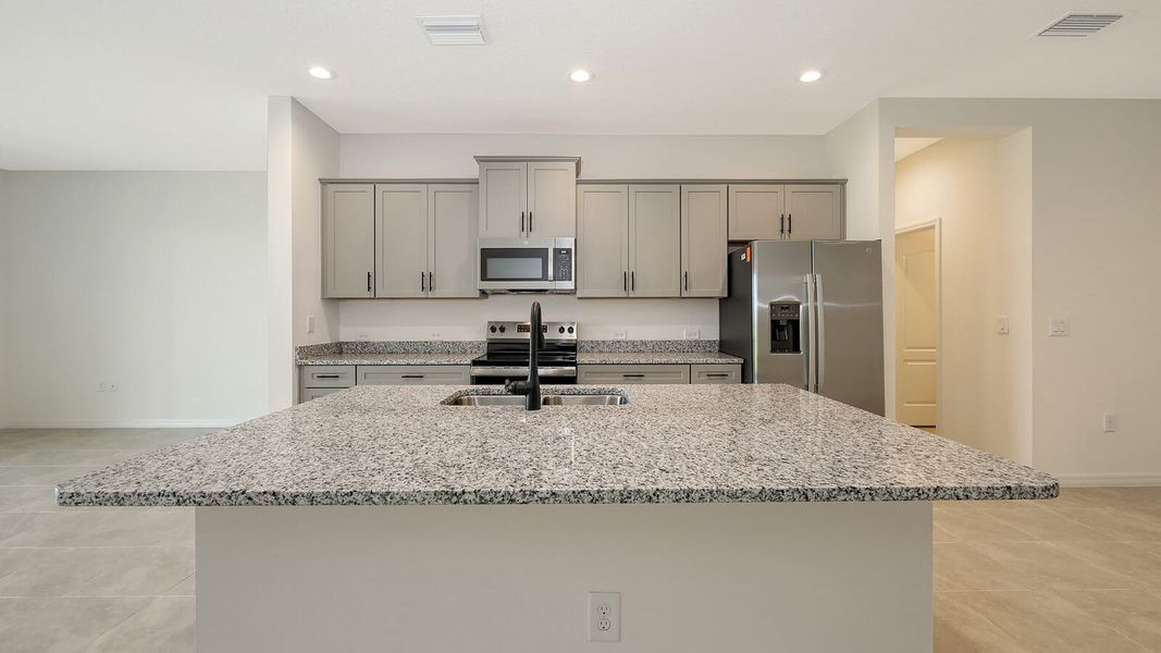 Furnished interior view inside a new home in Palm Grove Real Estate and Homes for Sale in Lakewood Ranch, FL - Neal Communities, Lakewood Ranch (Image 11).