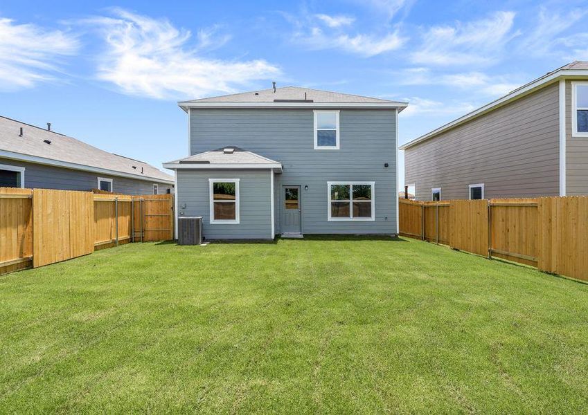 The back yard of the Colorado floor plan is fully fenced-in.