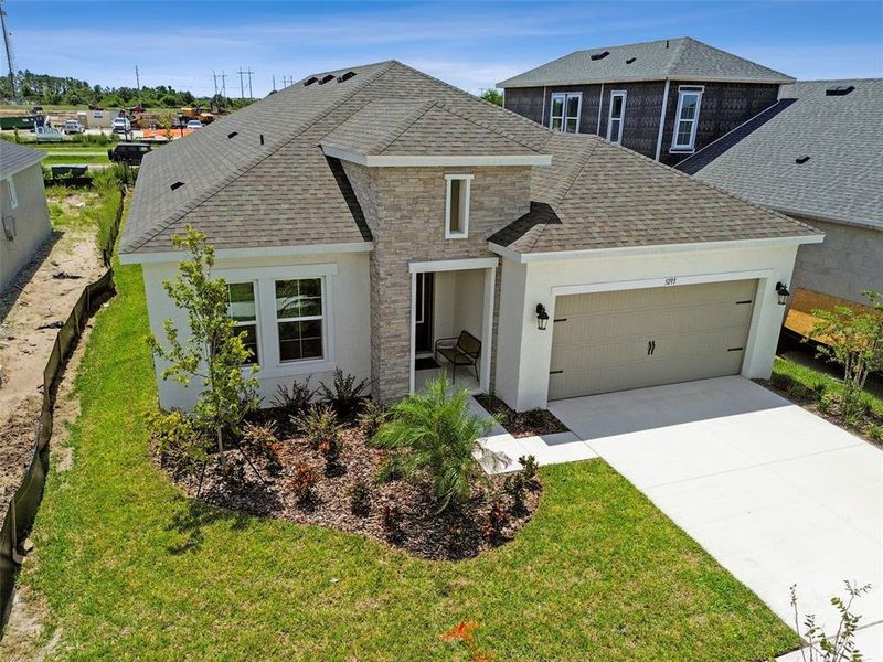 Front exterior of a new home in Waterset, Apollo Beach, FL, highlighting curb appeal (Image 25). Front exterior of a new home in Waterset, Apollo Beach, FL, highlighting curb appeal (Image 25).
