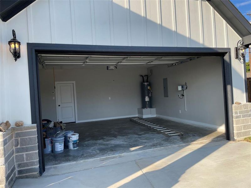 Garage with electric panel and electric water heater