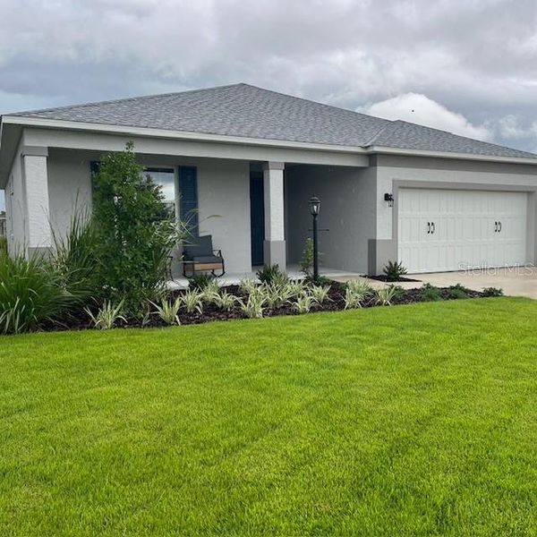 Front exterior of a new home in , Ocala, FL, highlighting curb appeal (Image 2).