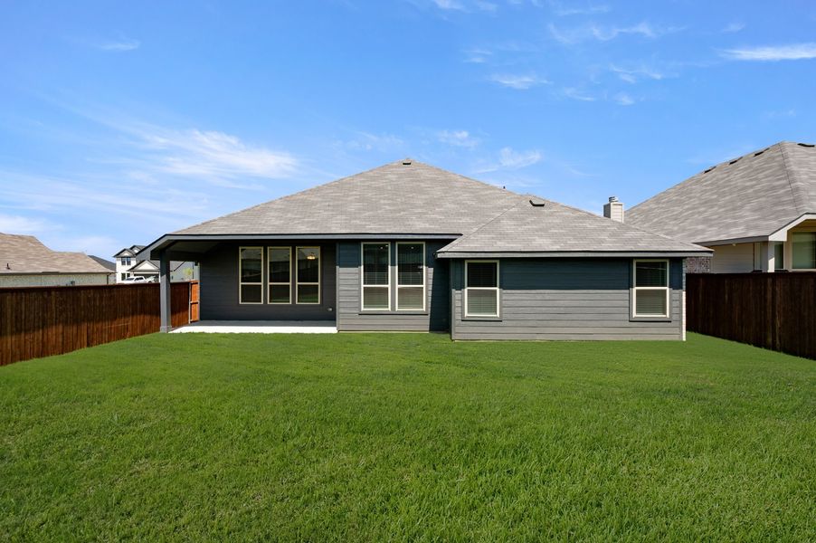 Front exterior of a new home in Still Water Lake Estates, Godley, TX, highlighting curb appeal (Image 26).