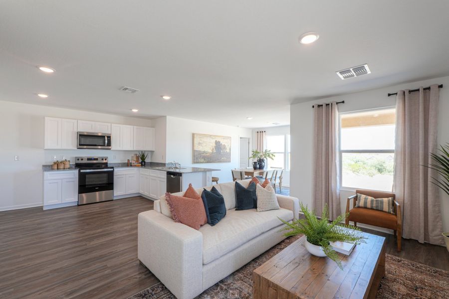 A living room with a couch and a table.