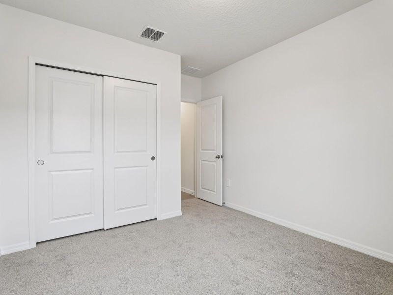 Spacious, unfurnished interior of a new home in The Grove at Stuart Crossing - Classic Series, Bartow (Image 15).