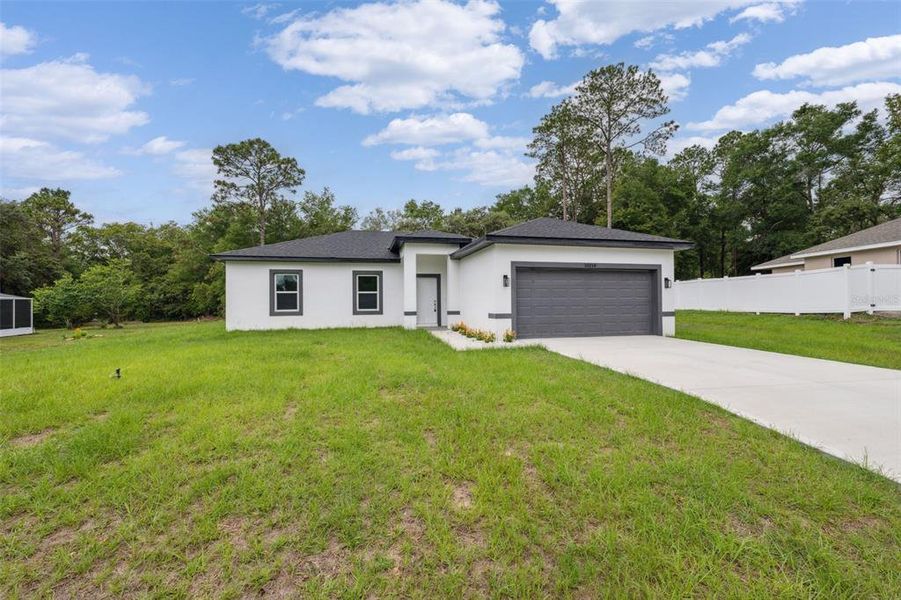 Front exterior of a new home in , Citrus Springs, FL, highlighting curb appeal (Image 27).