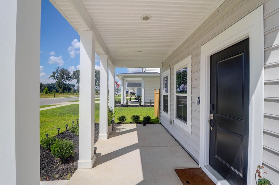 Exterior details and patio area of a home in Sweetgrass at Summers Corner: Arbor Collection, Summerville (Image 25).