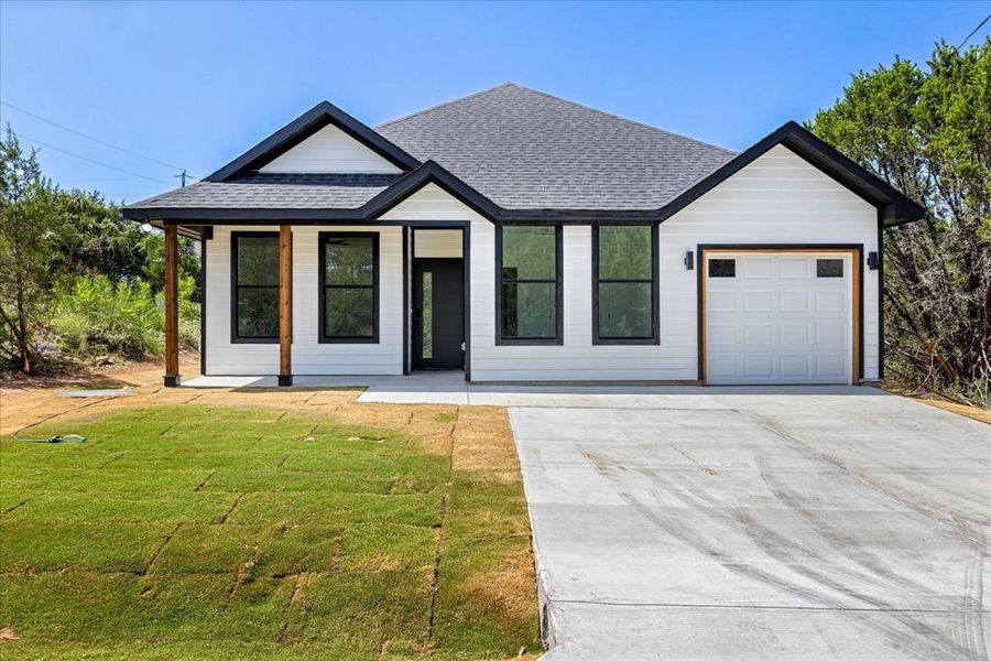 Front exterior of a new home in , Granbury, TX, highlighting curb appeal (Image 17). Front exterior of a new home in , Granbury, TX, highlighting curb appeal (Image 17).