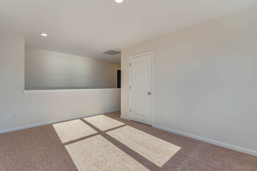 Representative unfurnished interior of a home built from the HAYDEN by D.R. Horton in Island Green, Myrtle Beach (Image 21).
