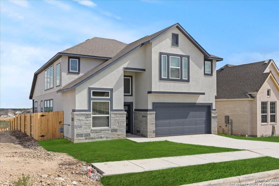 Front exterior of a new home in Meyer Ranch, New Braunfels, TX, highlighting curb appeal (Image 16).