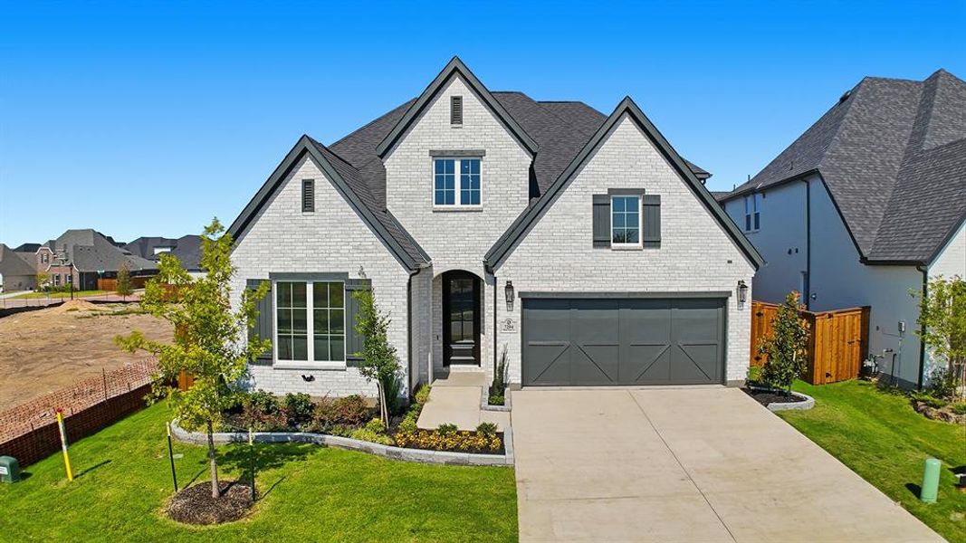 View of front of home featuring brick siding, concrete driveway, a garage, and a shingled roof View of front of home featuring brick siding, concrete driveway, a garage, and a shingled roof