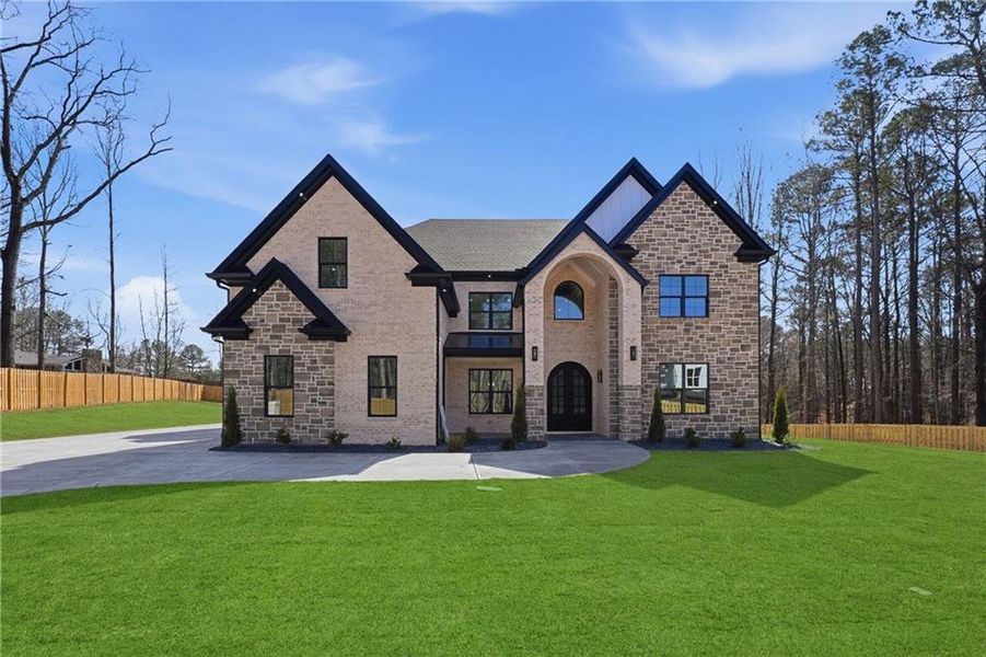 Front exterior of a new home in , Lawrenceville, GA, highlighting curb appeal (Image 26).