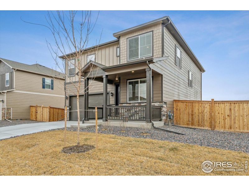 Front exterior of a new home in Settlers Crossing, Commerce City, CO, highlighting curb appeal (Image 17). Front exterior of a new home in Settlers Crossing, Commerce City, CO, highlighting curb appeal (Image 17).