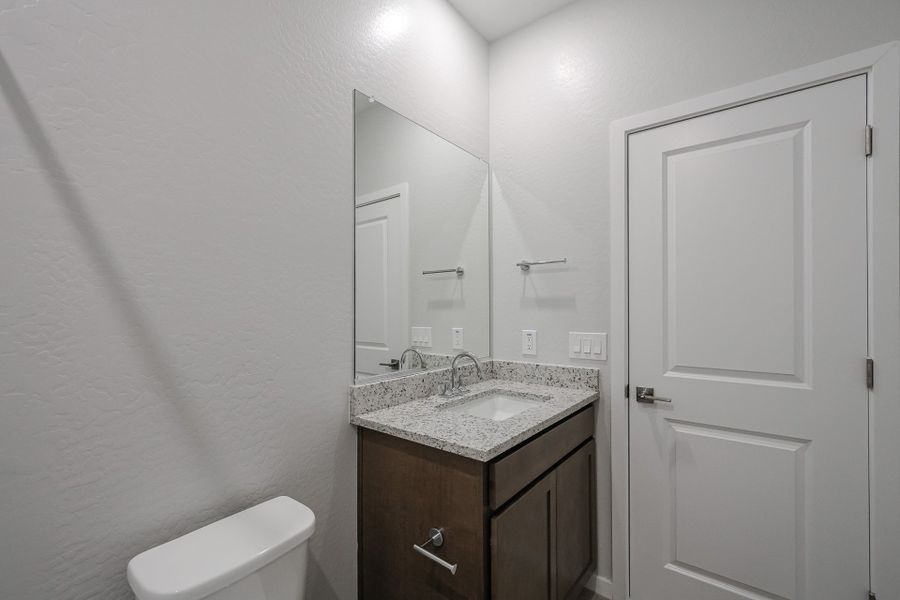 A bathroom with a sink and a toilet.