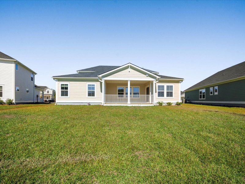 Exterior details and patio area of a home in The Coves at Lakes of Cane Bay II, Summerville (Image 27).