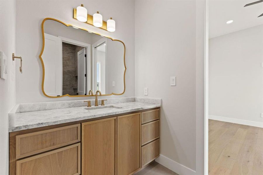 Bathroom with vanity, light wood-style floors Bathroom with vanity, light wood-style floors