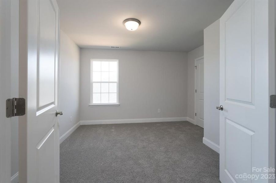 Representative unfurnished interior of a home built from the 3119 by Adams Homes in Hidden Pines, Cameron (Image 24).