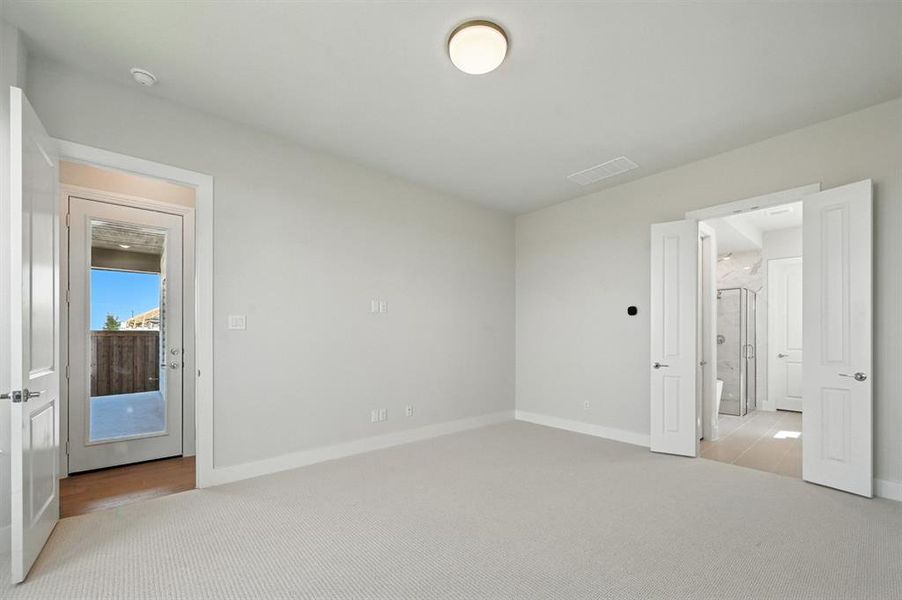 Unfurnished bedroom featuring light colored carpet Unfurnished bedroom featuring light colored carpet