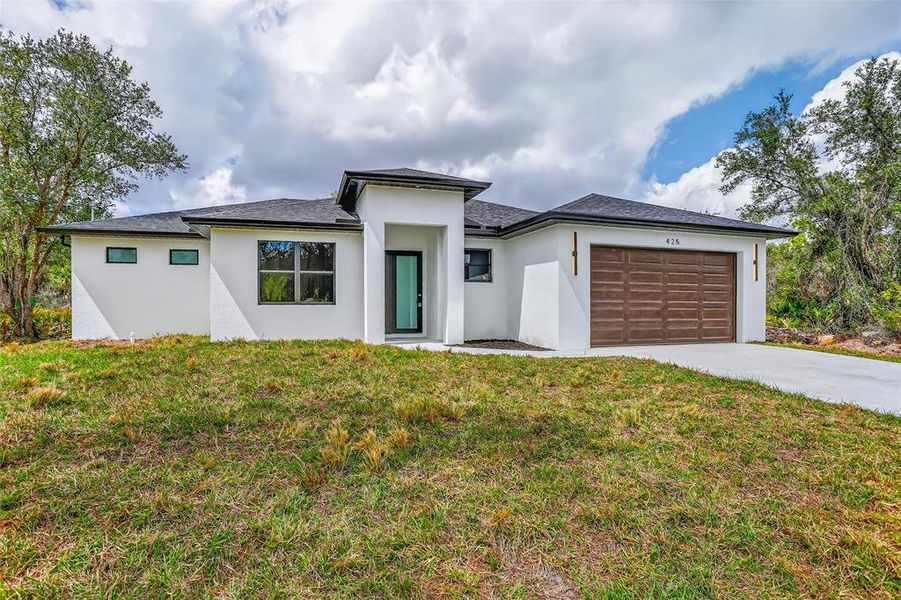 Front exterior of a new home in , Port Charlotte, FL, highlighting curb appeal (Image 28).