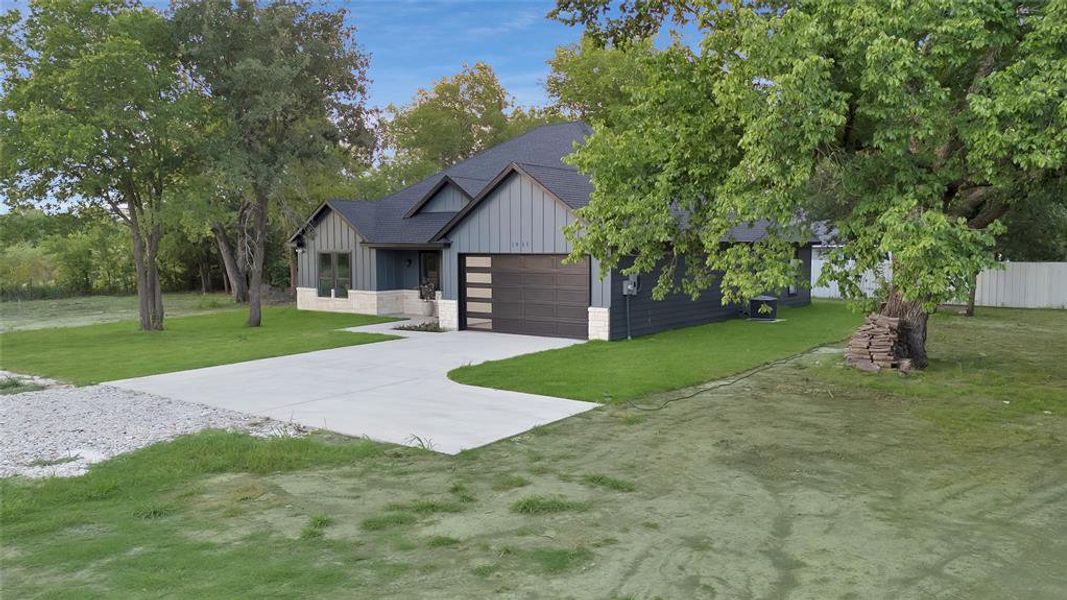 Front exterior of a new home in , Greenville, TX, highlighting curb appeal (Image 1). Front exterior of a new home in , Greenville, TX, highlighting curb appeal (Image 1).