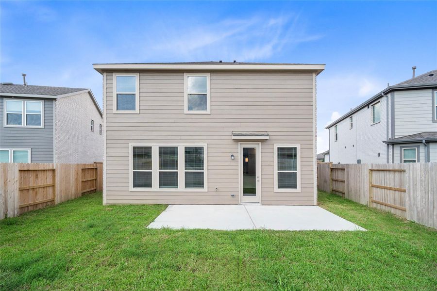Come explore this expansive backyard featuring a spacious patio slab—perfect for outdoor living! There's ample space for kids to play and adults to unwind. Ideal for patio furniture, a BBQ pit, and so much more—the possibilities are endless!
