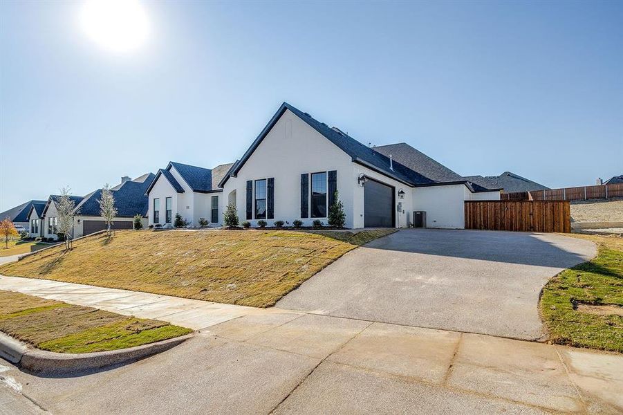 Front exterior of a new home in Whitestone Heights, Benbrook, TX, highlighting curb appeal (Image 2).