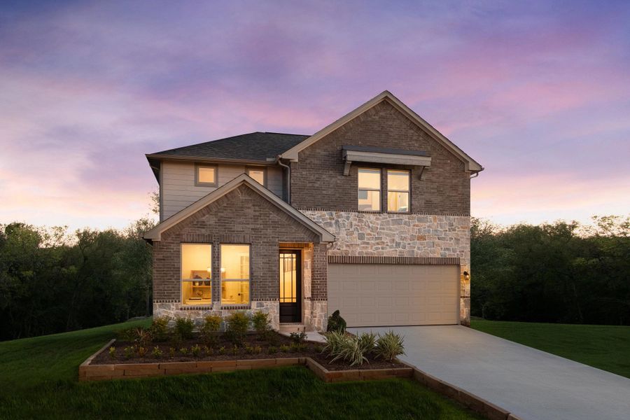 Representative exterior photo of a completed home built from the Austin by Ashton Woods in Blue Heron Estates, Mont Belvieu, TX (Image 16).