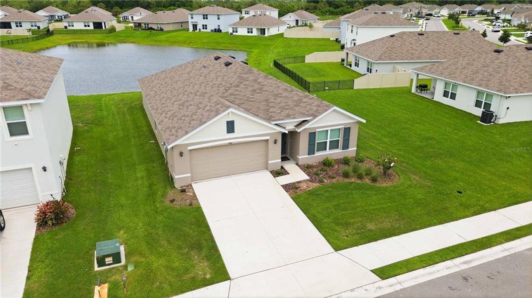 Front exterior of a new home in Mandarin Grove, Palmetto, FL, highlighting curb appeal (Image 22).