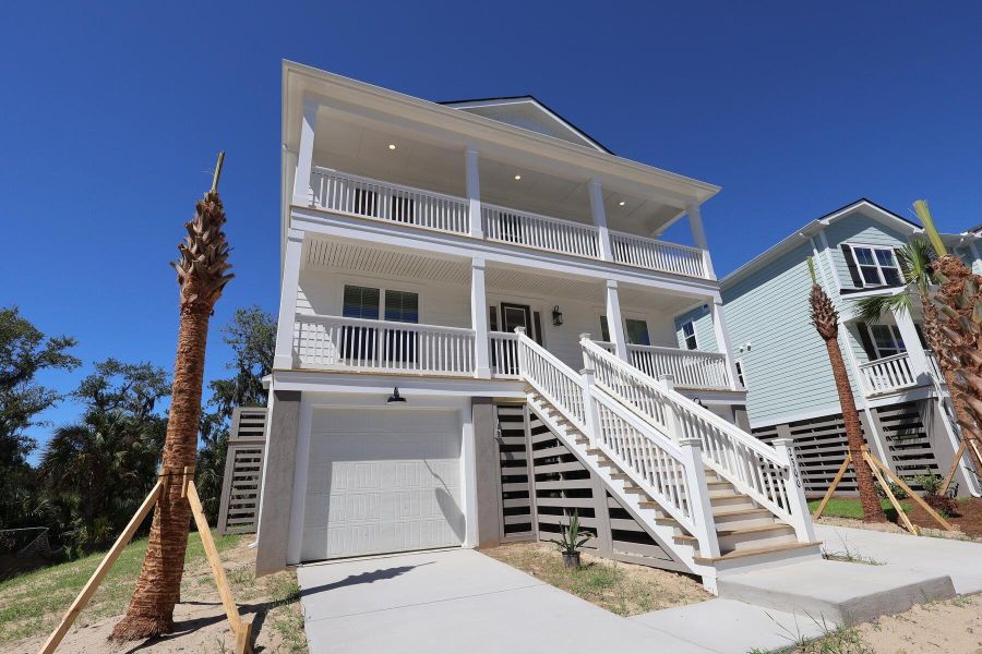 Front exterior of a new home in Liberty Hill Farm, Mount Pleasant, SC, highlighting curb appeal (Image 24). Front exterior of a new home in Liberty Hill Farm, Mount Pleasant, SC, highlighting curb appeal (Image 24).