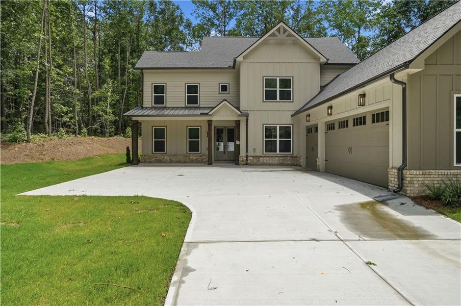 Front exterior of a new home in , Pendergrass, GA, highlighting curb appeal (Image 1). Front exterior of a new home in , Pendergrass, GA, highlighting curb appeal (Image 1).