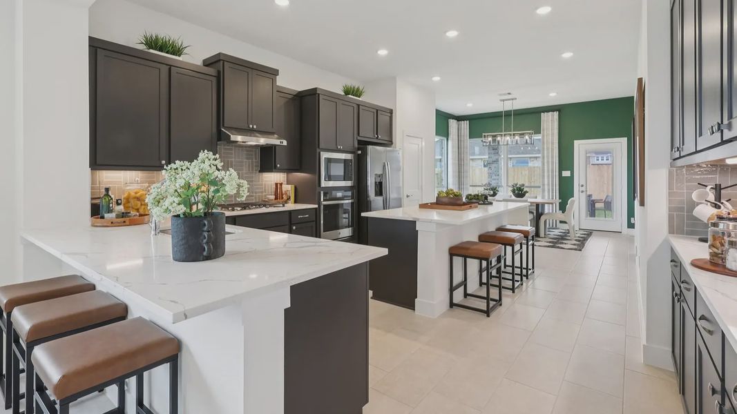 Representative furnished interior of a home built from the Adele by Chesmar Homes in Sunterra, Katy (Image 9).