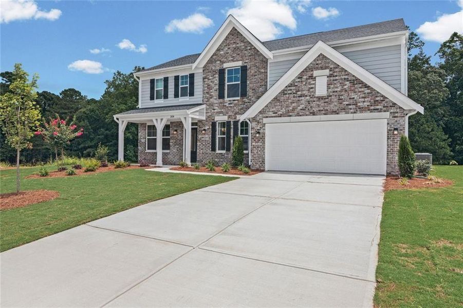 Front exterior of a new home in Pickens Bluff, Dallas, GA, highlighting curb appeal (Image 17).
