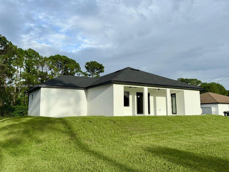 Front exterior of a new home in , Lehigh Acres, FL, highlighting curb appeal (Image 22).
