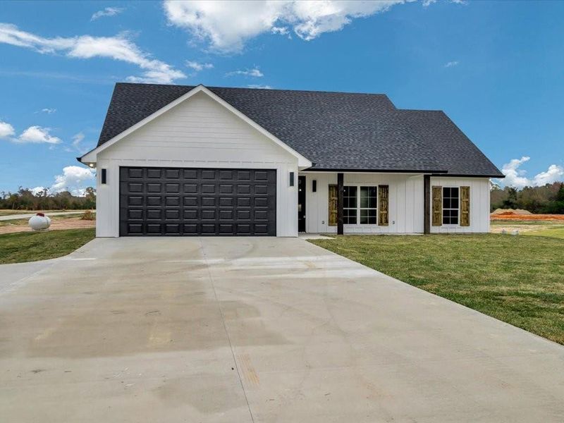 Front exterior of a new home in , Huntington, TX, highlighting curb appeal (Image 23).