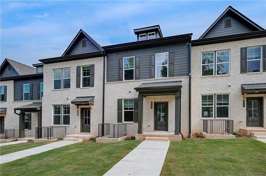 Front exterior of a new home in Daybreak, Newnan, GA, highlighting curb appeal (Image 17). Front exterior of a new home in Daybreak, Newnan, GA, highlighting curb appeal (Image 17).