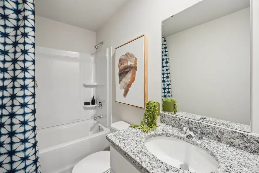 A bathroom with a sink and a bathtub.