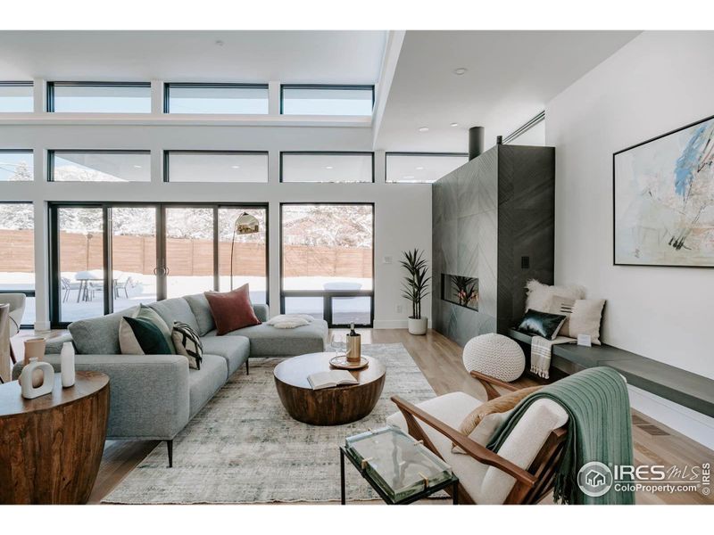 Cozy up to a warm fire with this custom linear fireplace and asymmetrical hearth.