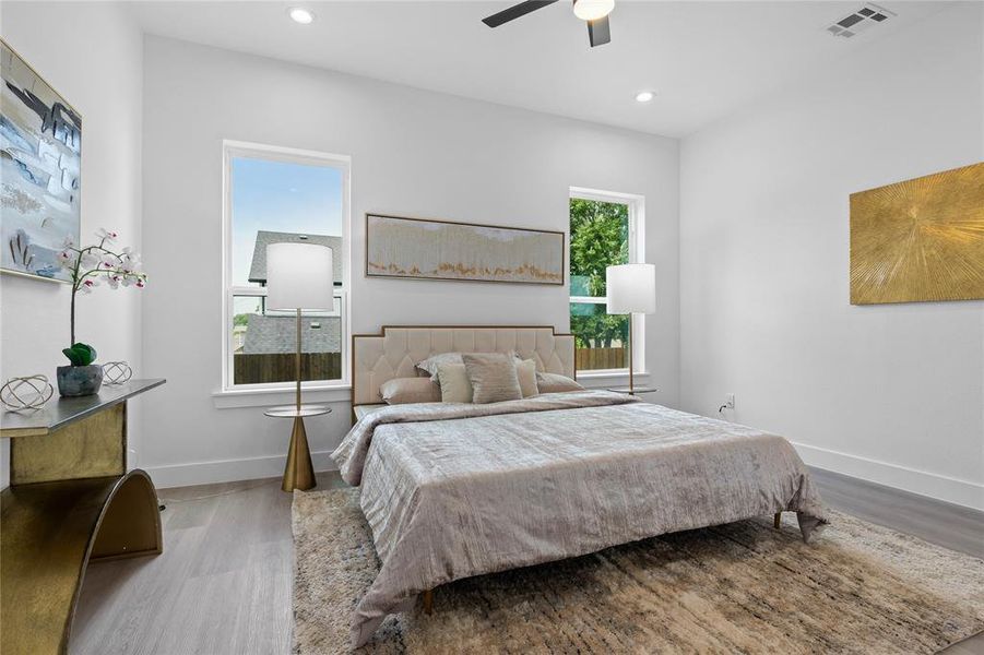Bedroom featuring wood finished floors, recessed lighting, and ceiling fan Bedroom featuring wood finished floors, recessed lighting, and ceiling fan