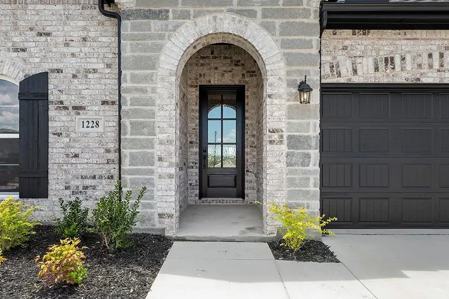 Exterior details and patio area of a home in Walden Pond, Forney (Image 4).