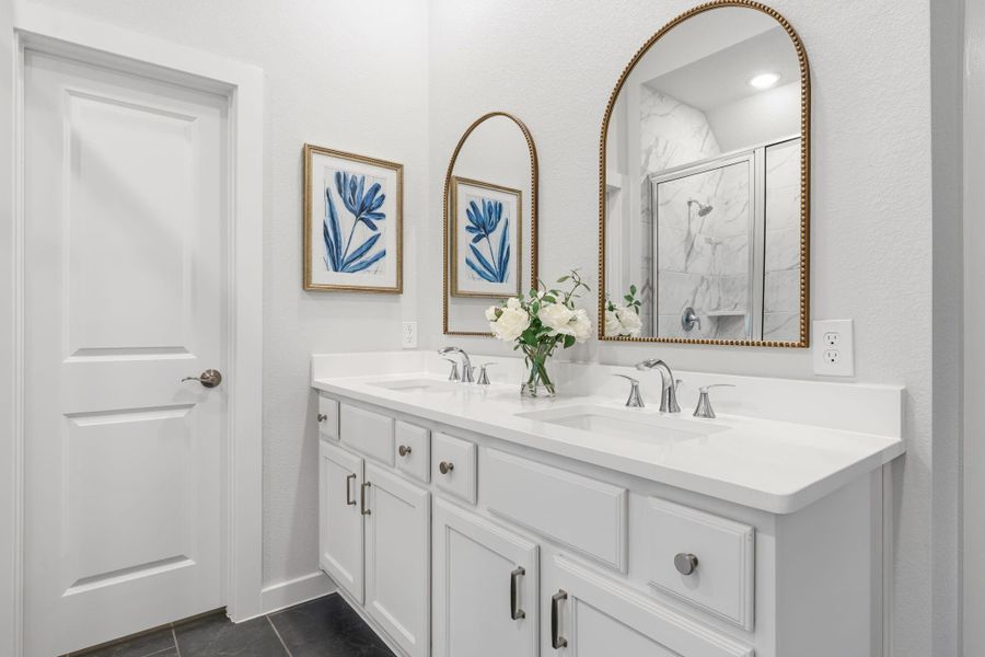 Double sinks, updated mirrors, and cabinet hardware in all of the bathrooms upstairs