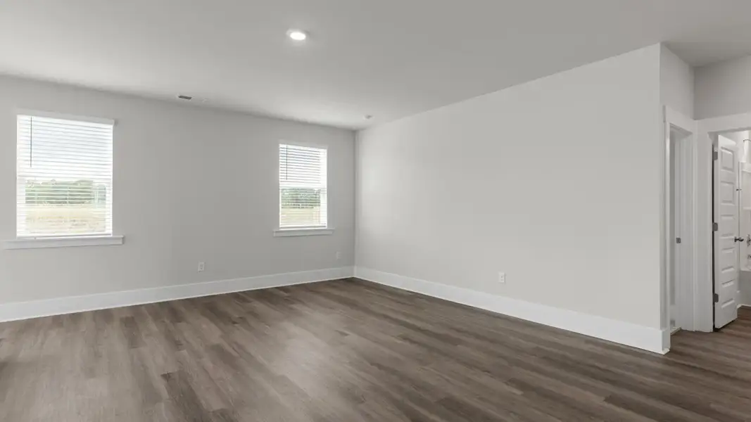 Spacious, unfurnished interior of a new home in The Highlands at Cedar Hill Landing, Navassa (Image 14).