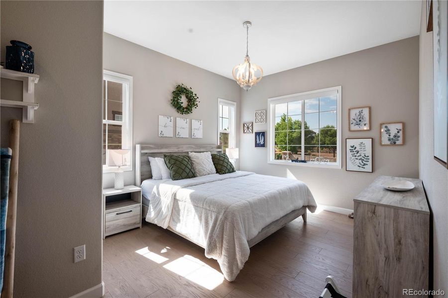 Main Floor Bedroom with Natural Light and Attached Bathroom