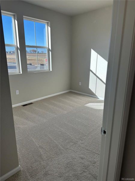 Spacious, unfurnished interior of a new home in The Legacy Collection at Talon Pointe, Thornton (Image 10).